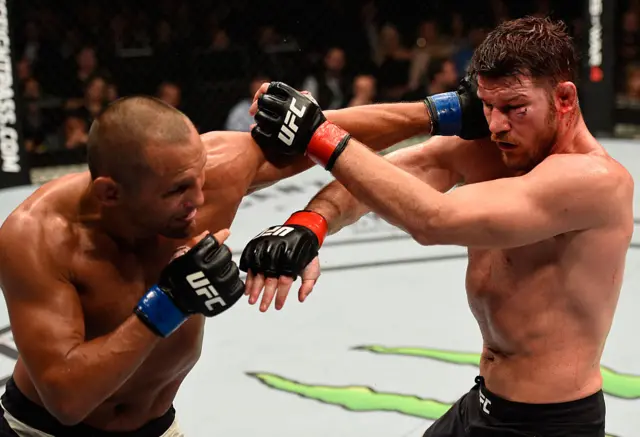 Dan Henderson punches Michael Bisping