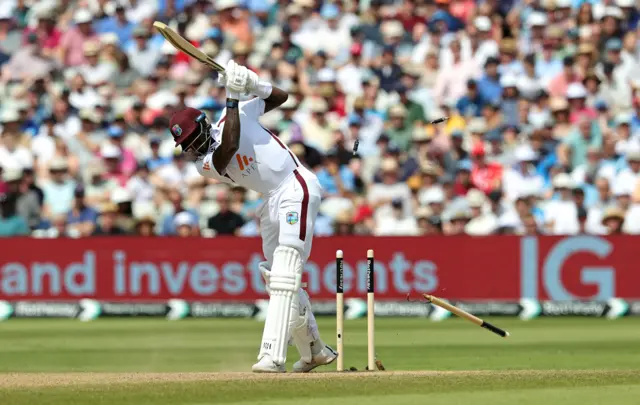 Alzarri Joseph is bowled by Mark Wood