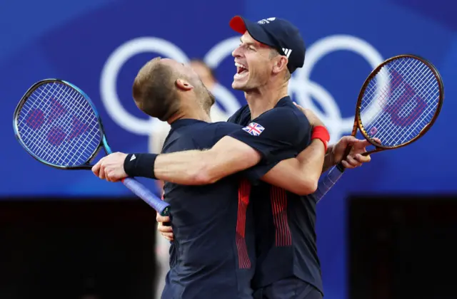 Andy Murray of Team Great Britain (R) and partner Dan Evans of Team Great Britain