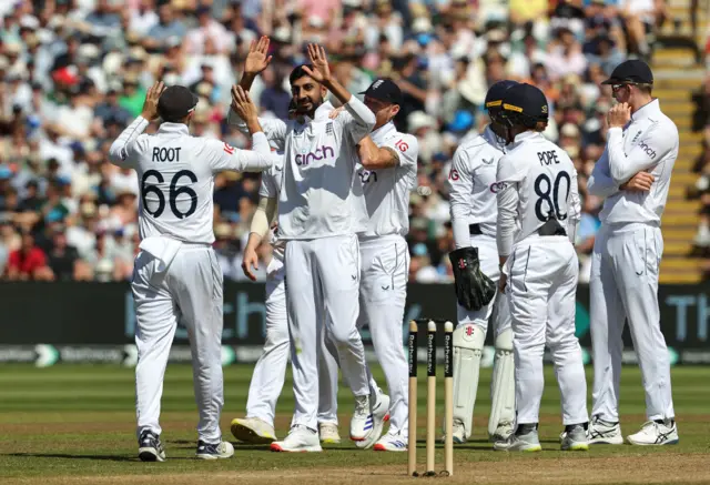 Shoaib Bashir and Joe Root celebrate a wicket