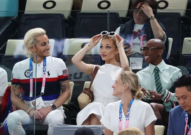 Ariana Grande watching the gymnastics