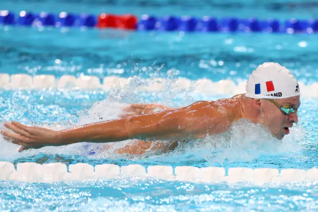 Leon Marchand in action at the Olympics