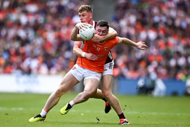 Oisin Conaty of Armagh in action against Dylan McHugh of Galway