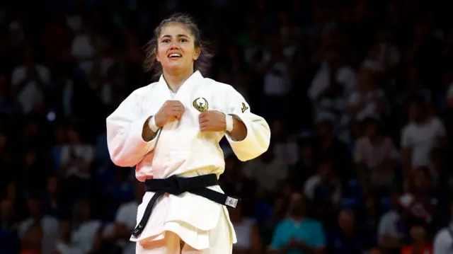 Diyora Keldiyorova of Uzbekistan reacts after winning her bout against Distria Krasniqi of Kosovo