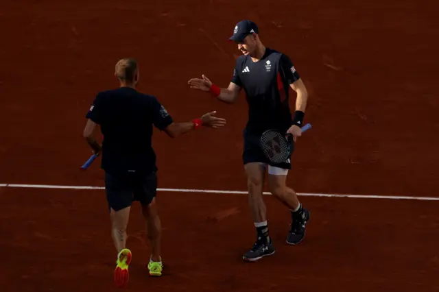 Murray and Evans high five after winning a point