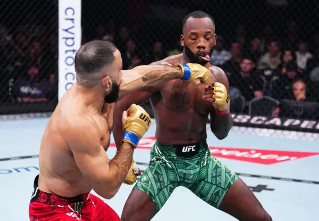 Leon Edwards is punched by Belal Muhammad