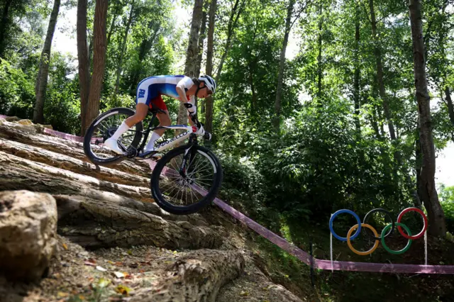 Ferrand-Prevot scales a hill in the mountain bike race