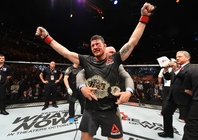 Michael Bisping gets the UFC middleweight title wrapped around his waist