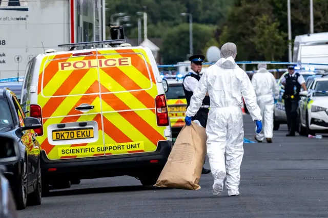 Forensic officers in Southport