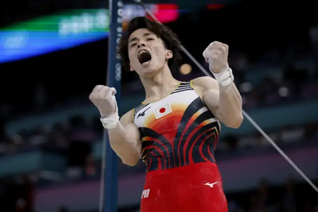 Sukino shouts and waves his arms after a strong showing