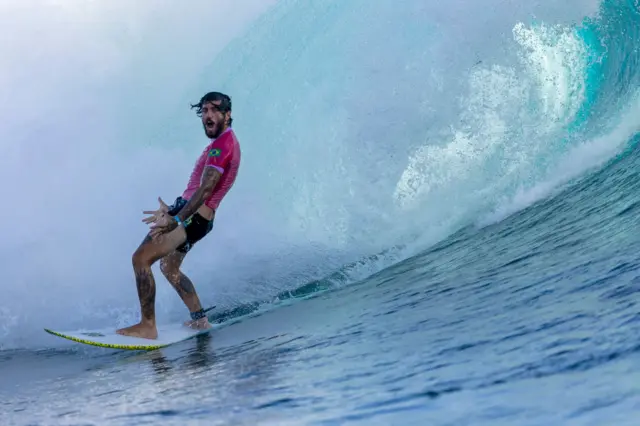 Brazil's Felipe Toledo celebrating as he exits a wave