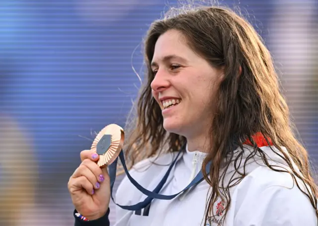 Kimberley Woods holds her bronze medal