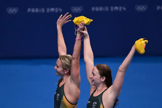 O'Callaghan and Titmus raise their hands together to the crowd