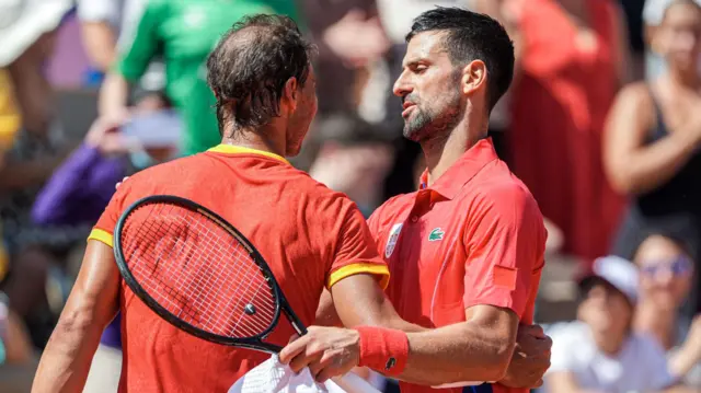 Novak Djokovic and Rafael Nadal embrace