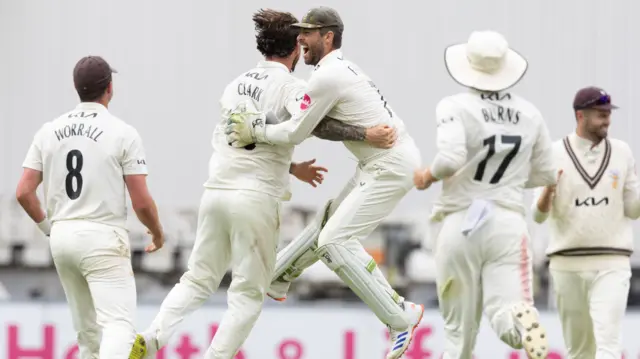 Surrey players celebrate their win