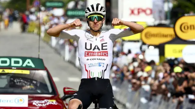 Tadej Pogacar celebrates winning stage four