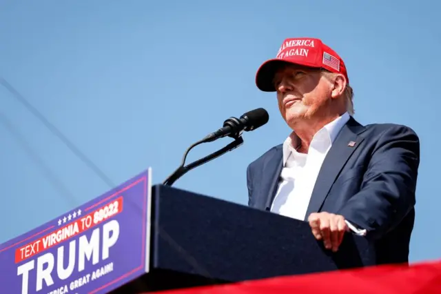 Former President Trump at campaign podium