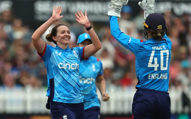 Kate Cross celebrates the wicket of Maddy Green