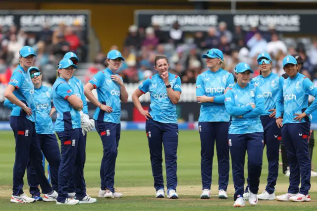 England watch the big screen during a review