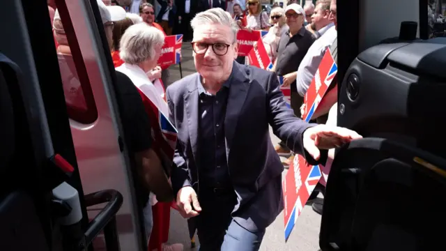 Keir Starmer boards the Labour campaign bus in Burton-on-Trent