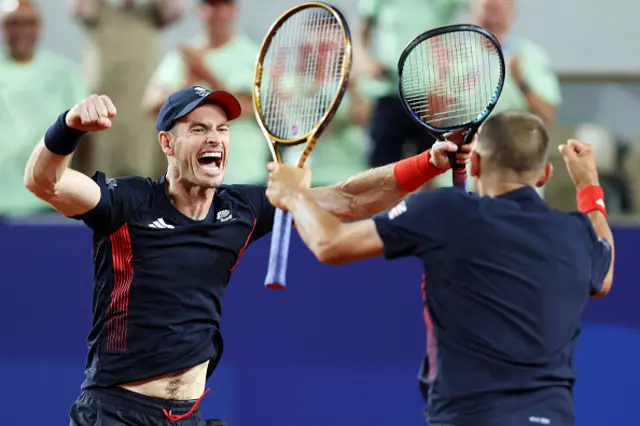 Andy Murray of Team Great Britain celebrates with partner Dan Evans