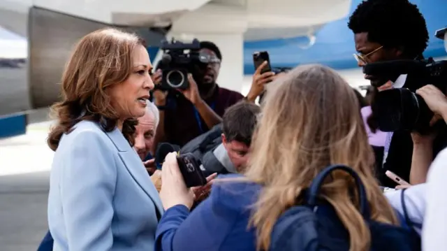 Description U.S. Vice President Kamala Harris talks to reporters on her arrival in Atlanta, Georgia, U.S., July 30, 2024.