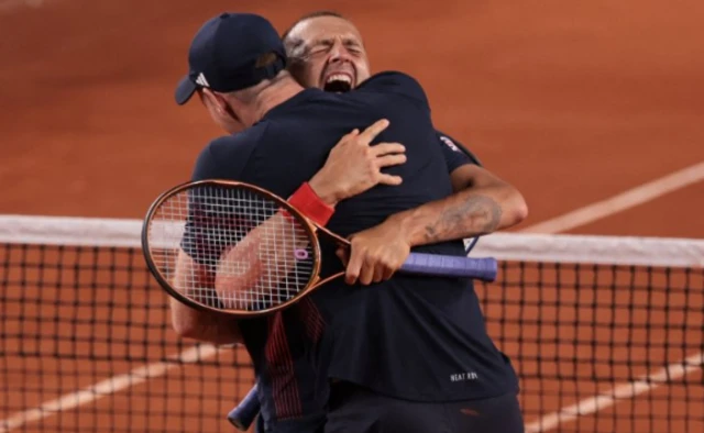 Andy Murray and Dan Evans hug