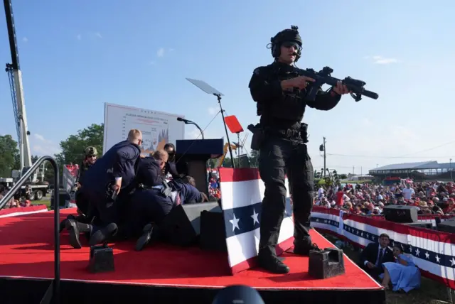 Security reacts after shooting at rally