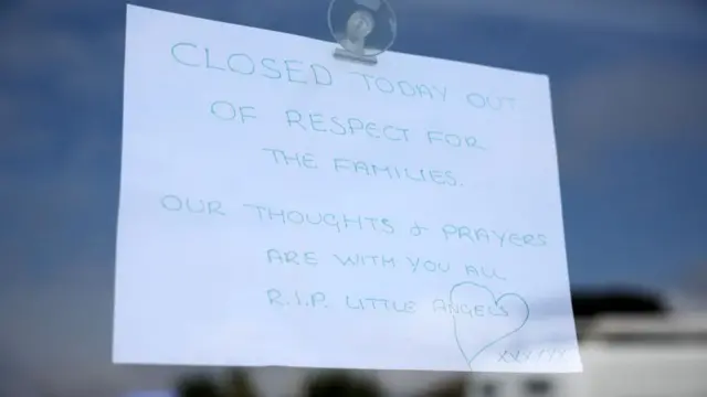 A sign hangs from the window of a closed shop near the site of a stabbing attack on Hart Street