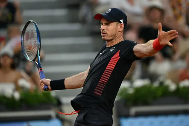 Andy Murray playing with Britain's Daniel Evans reacts playing Belgium's Sander Gille