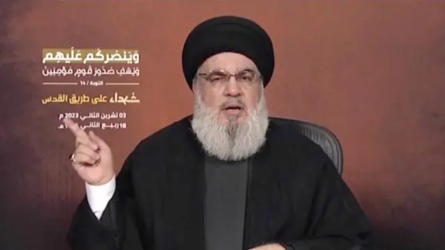 Sheikh Hassan Nasrallah, the leader of Hezbollah, gestures during a TV appearance