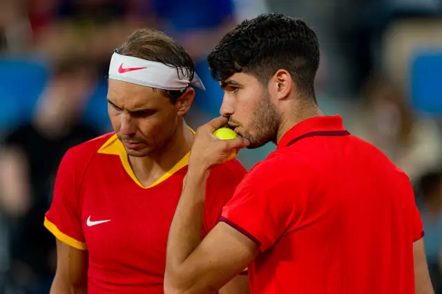 Rafael Nadal (L) and partner Carlos Alcaraz of Team Spain talk tactics