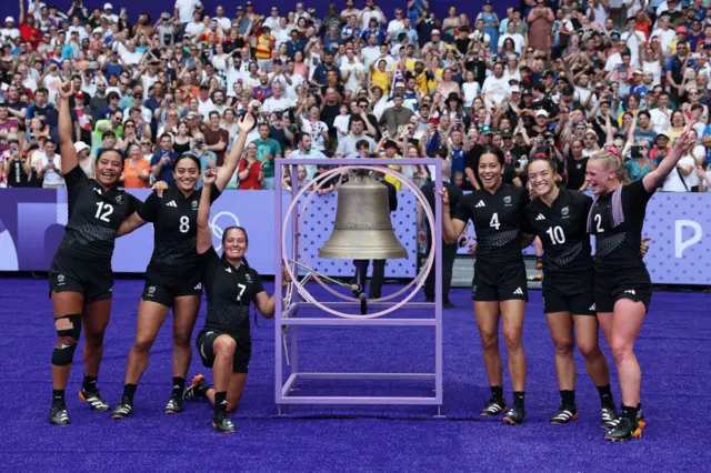 The New Zealand rugby sevens women's team celebrate after defeating the USA in the semi-finals