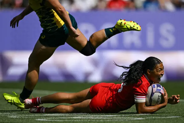 Canada's Asia Hogan-Rochester scores a try during the women's semi-final rugby sevens match between Canada and Australia