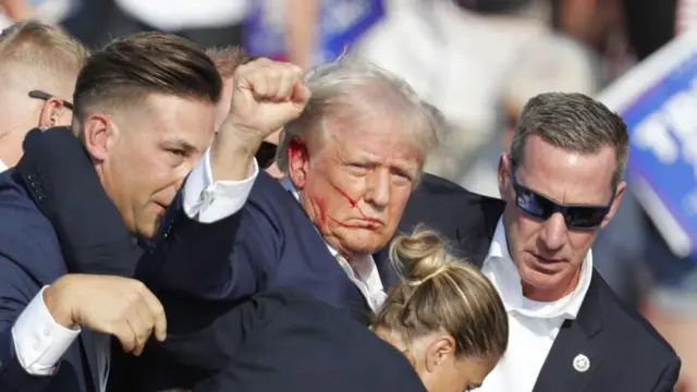 Former US President Donald Trump is rushed off stage by secret service after an incident during a campaign rally at the Butler Farm Show Inc. in Butler, Pennsylvania, USA, 13 July 2024.