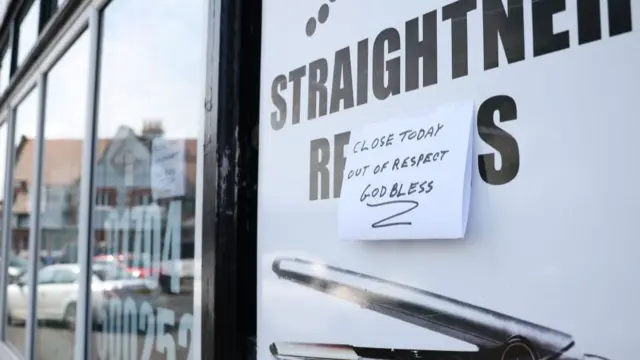 A sign hangs at a closed shop near the site of a stabbing attack on Hart Street in Southport