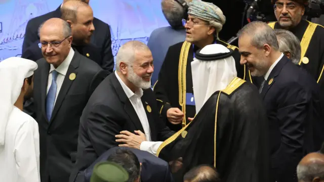 Hamas leader Ismail Haniyeh arrives before Iranian president-elect swearing-in ceremony at the Iranian parliament in Tehran.