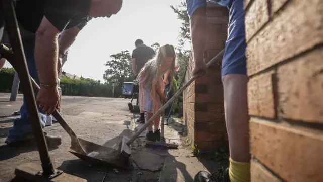 Volunteers cleaning on Sussex Road in Southport