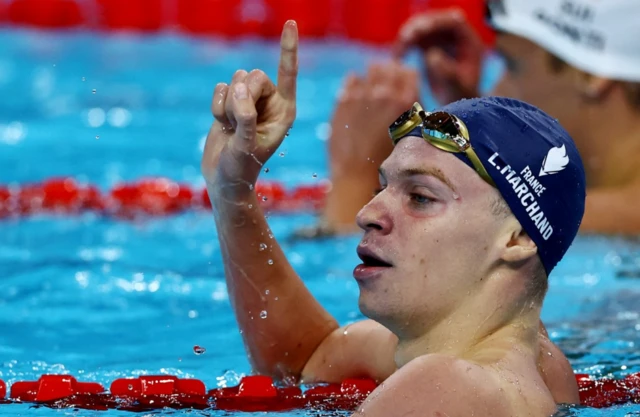 Leon Marchand of France reacts