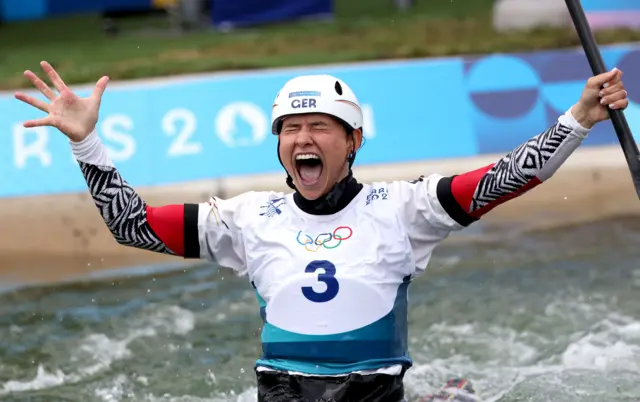 Elena Lillik cleebrates her amazing canoe slalom run