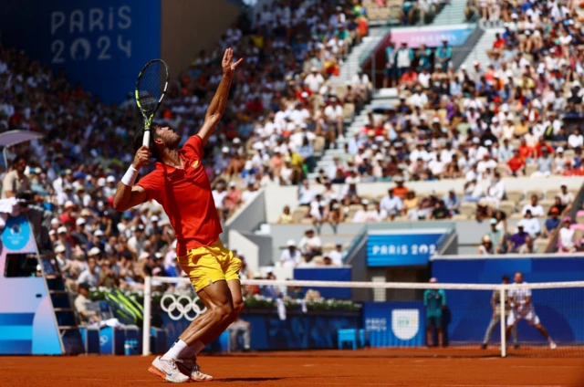 Carlos Alcaraz serving