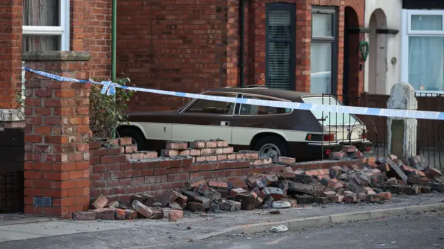 A broken wall in Southport this morning