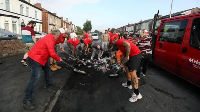 Volunteers sweep Sussex road