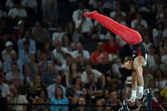 Jarman flies around the high bars in the all-around final