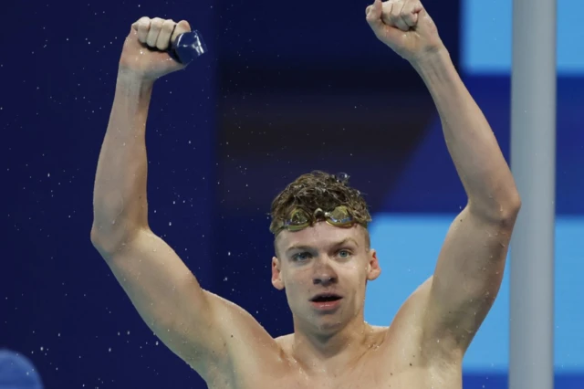 Leon Marchand of France celebrates