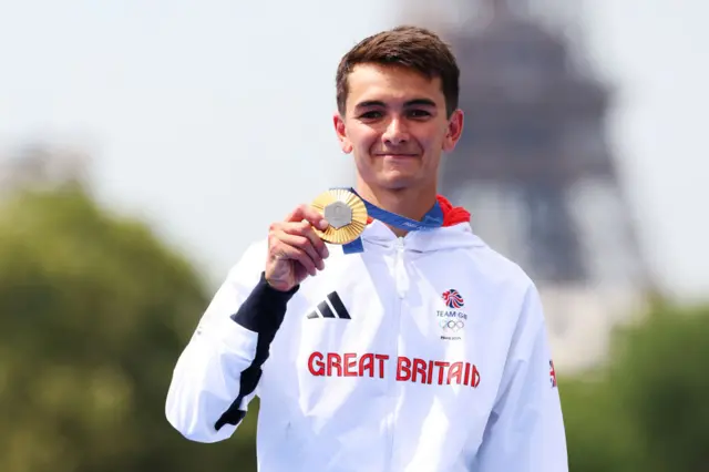 Alex Yee poses with his gold medal