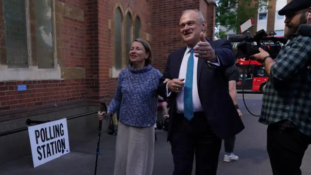 Liberal Democrat leader Sir Ed Davey and his wife Emily Gasson voted in south-west London