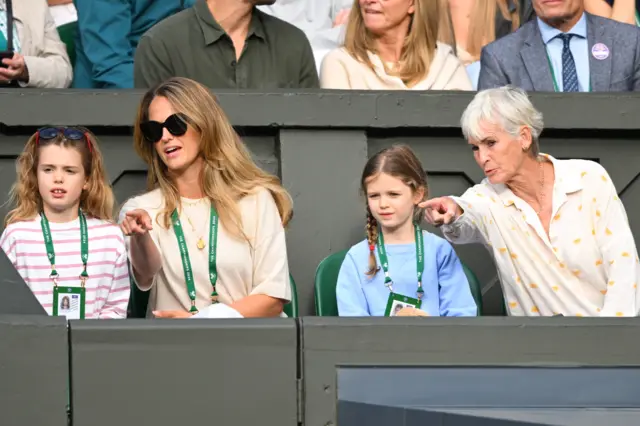 Kim Sears and Judy Murray sit with kids in the player box