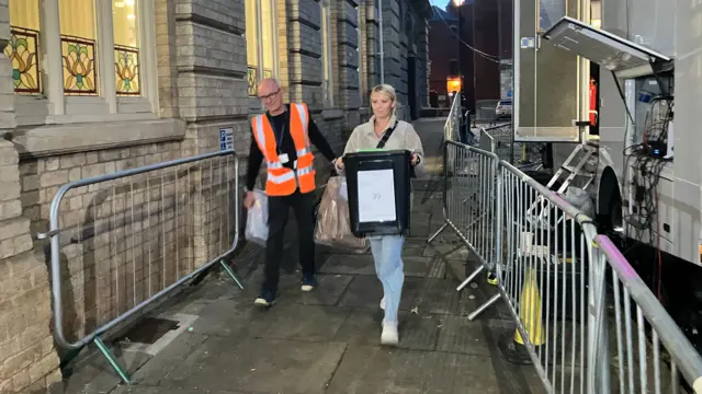 A ballot box is carried into Grimsby Town Hall