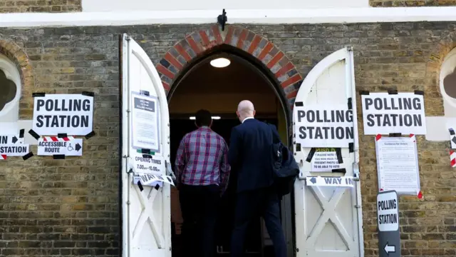 People enter a polling station